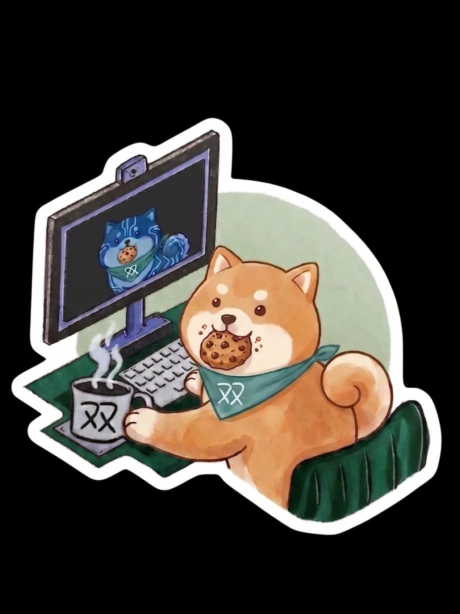 The shiba at his desk with his twin on the monitor